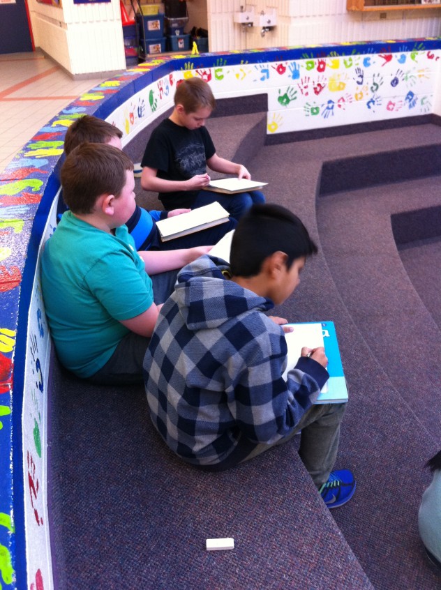 Students working together to examine and reimagine the artwork. 