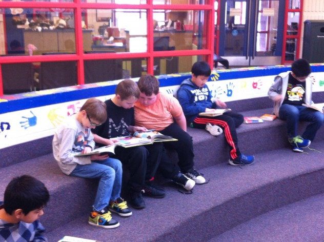 Reading our new library books in the atrium. 