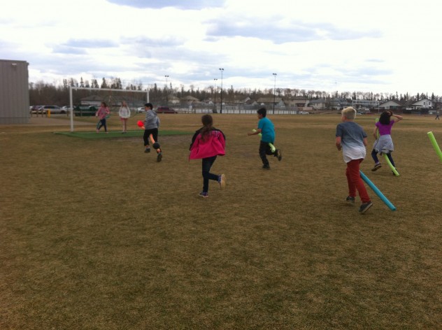 Students "flying" towards the goal posts. 